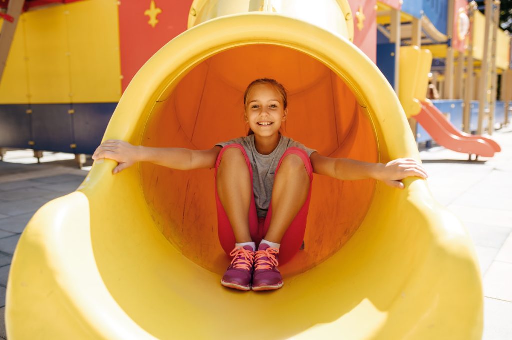 Girl on Yellow Slide